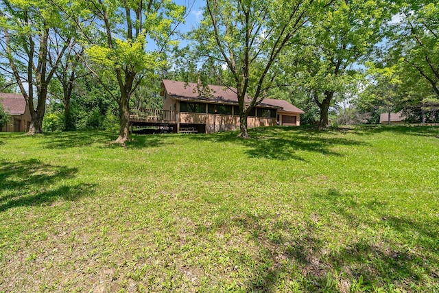 11606 235th St E, Lakeville, MN 55044 - view of grassy yard featuring a deck and a garage