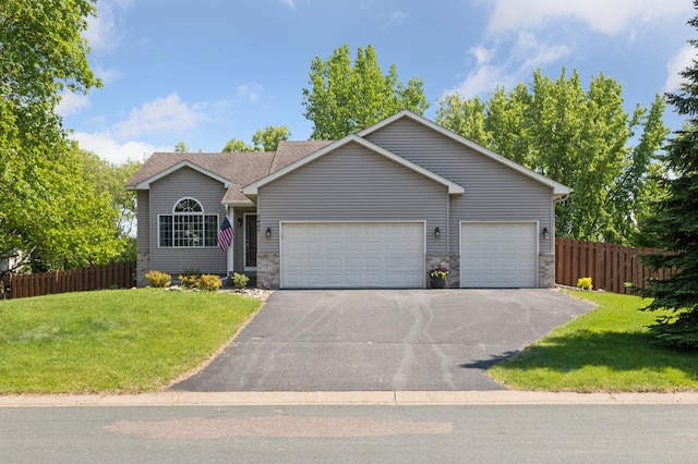 6449 151st St N, Hugo, MN 55038 - ranch-style house featuring an attached garage, asphalt driveway, and stone siding