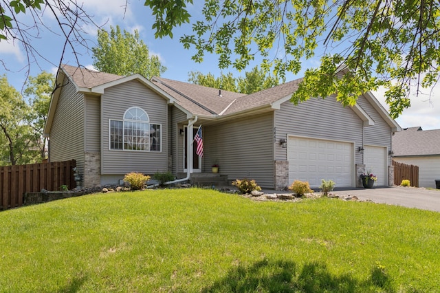 6449 151st St N, Hugo, MN 55038 - ranch-style home featuring a garage, driveway, brick siding, and a shingled roof