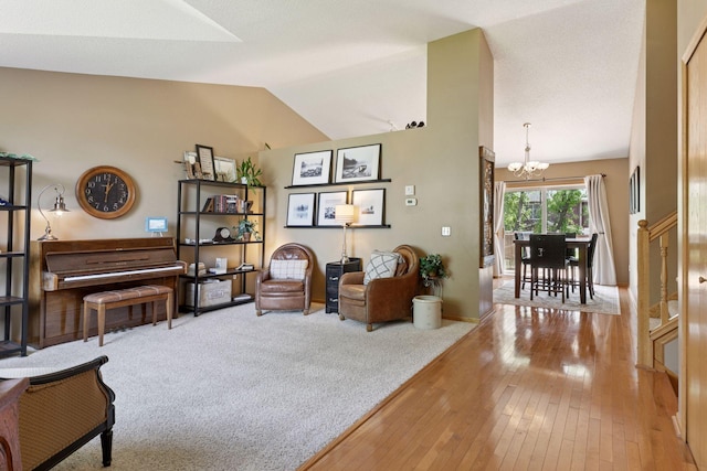 6449 151st St N, Hugo, MN 55038 - living area with a chandelier, wood-type flooring, lofted ceiling, and baseboards