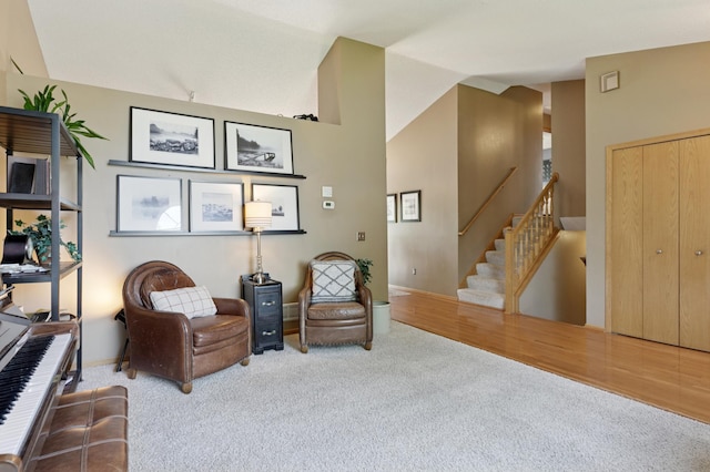 6449 151st St N, Hugo, MN 55038 - living area featuring carpet floors, vaulted ceiling, stairway, and baseboards