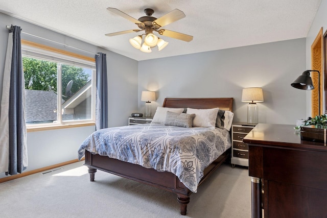 6449 151st St N, Hugo, MN 55038 - bedroom with light colored carpet, a ceiling fan, baseboards, and a textured ceiling