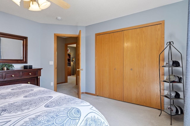 6449 151st St N, Hugo, MN 55038 - bedroom featuring light carpet, a closet, ceiling fan, and baseboards