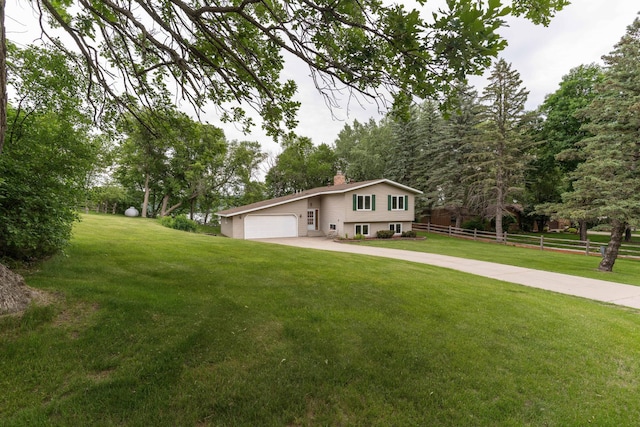 20619 Hillcrest Rd, Elizabeth Twp, MN 56537 - split level home featuring a chimney, driveway, and a garage
