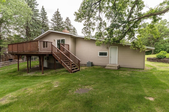 20619 Hillcrest Rd, Elizabeth Twp, MN 56537 - rear view of house featuring a wooden deck, entry steps, stairs, central AC, and a chimney