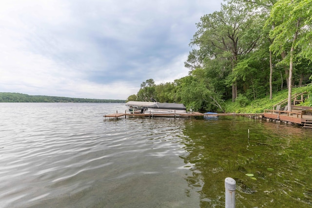 20619 Hillcrest Rd, Elizabeth Twp, MN 56537 - dock with a water view, boat lift, and a wooded view