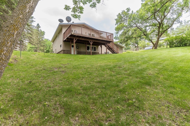 20619 Hillcrest Rd, Elizabeth Twp, MN 56537 - rear view of house with stairway, a wooden deck, and a lawn