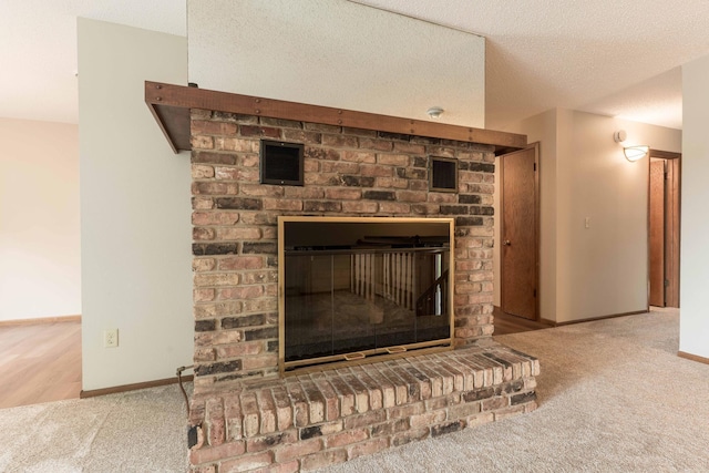 20619 Hillcrest Rd, Elizabeth Twp, MN 56537 - detailed view of carpet, baseboards, a fireplace, and a textured ceiling