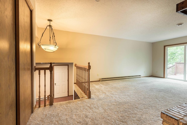 20619 Hillcrest Rd, Elizabeth Twp, MN 56537 - carpeted foyer entrance featuring a baseboard radiator, a textured ceiling, and baseboards