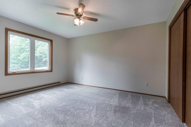 20619 Hillcrest Rd, Elizabeth Twp, MN 56537 - unfurnished bedroom featuring light colored carpet, a closet, a textured ceiling, baseboards, and a ceiling fan