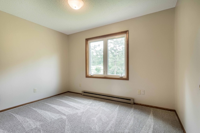 20619 Hillcrest Rd, Elizabeth Twp, MN 56537 - empty room with baseboard heating, carpet flooring, baseboards, and a textured ceiling