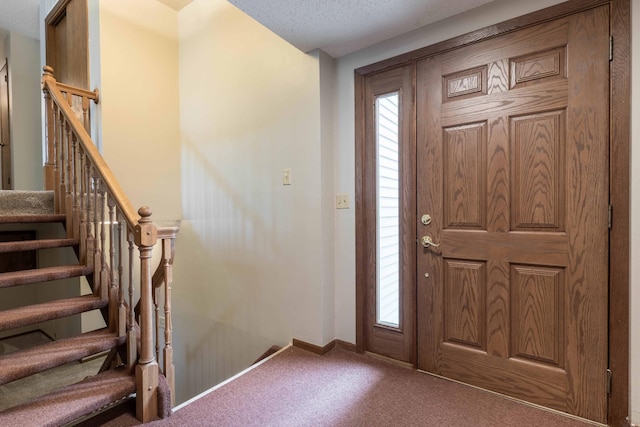 20619 Hillcrest Rd, Elizabeth Twp, MN 56537 - carpeted entrance foyer with baseboards, stairs, and a textured ceiling