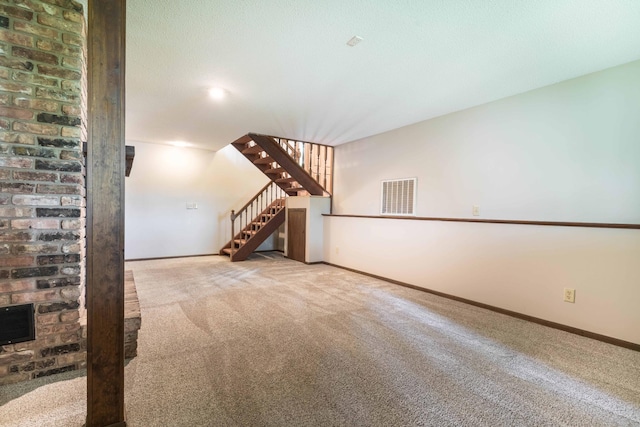 20619 Hillcrest Rd, Elizabeth Twp, MN 56537 - unfurnished living room with carpet, stairway, baseboards, and heating unit