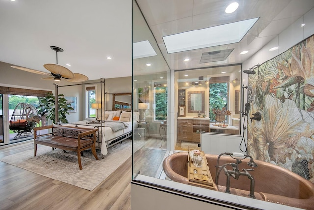 2311 Swan Dr, Mendota Heights, MN 55120 - bedroom with a skylight and wood finished floors