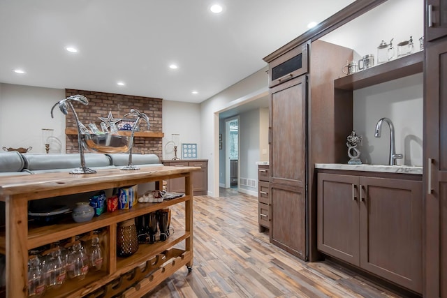 2311 Swan Dr, Mendota Heights, MN 55120 - kitchen featuring a sink, light wood-type flooring, recessed lighting, light countertops, and baseboards