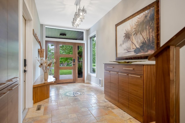 2311 Swan Dr, Mendota Heights, MN 55120 - foyer with stone tile floors, baseboards, and a chandelier