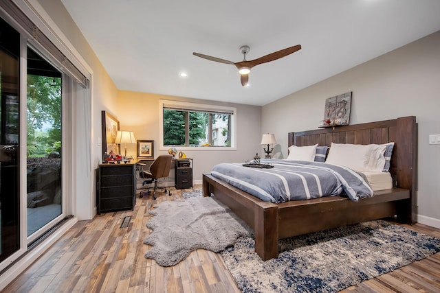 2311 Swan Dr, Mendota Heights, MN 55120 - bedroom with wood finished floors, an office area, lofted ceiling, recessed lighting, and a ceiling fan