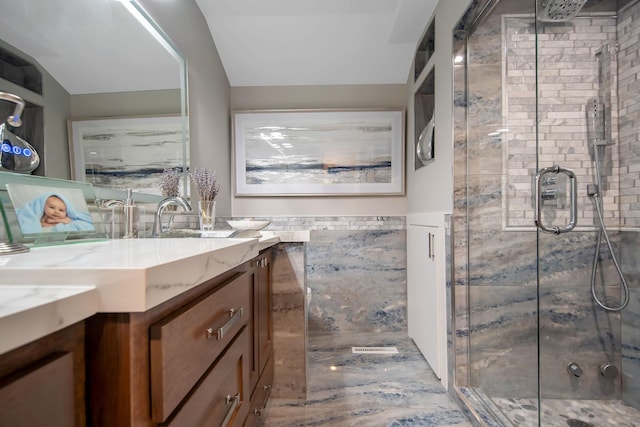 2311 Swan Dr, Mendota Heights, MN 55120 - bathroom with vanity, a shower stall, and a wainscoted wall