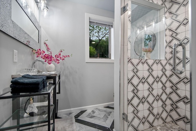 2311 Swan Dr, Mendota Heights, MN 55120 - bathroom with a tile shower, baseboards, marble finish floors, and vanity