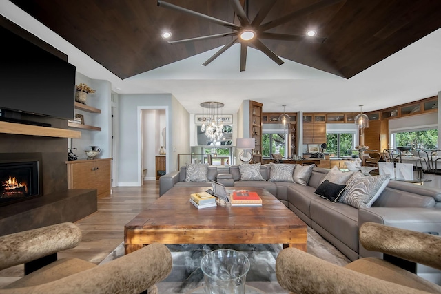 2311 Swan Dr, Mendota Heights, MN 55120 - living room with vaulted ceiling, wood finished floors, wood ceiling, a large fireplace, and baseboards