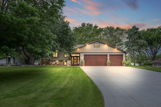 2311 Swan Dr, Mendota Heights, MN 55120 - view of front of house with driveway, an attached garage, and a front yard