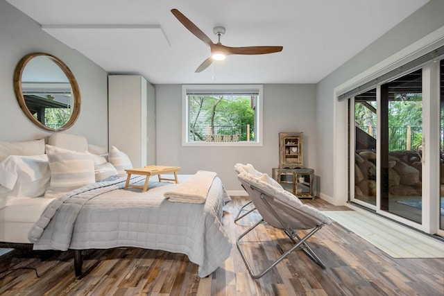 2311 Swan Dr, Mendota Heights, MN 55120 - bedroom featuring access to exterior, multiple windows, wood finished floors, and baseboards