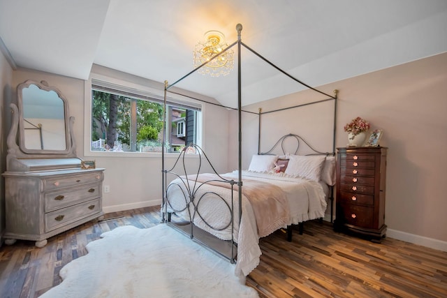 2311 Swan Dr, Mendota Heights, MN 55120 - bedroom with baseboards, wood finished floors, and a chandelier