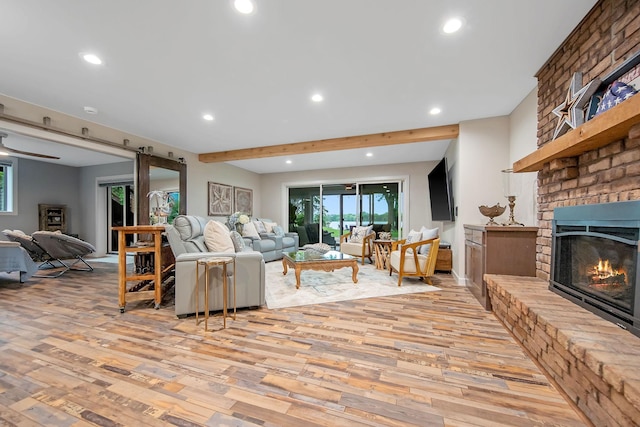 2311 Swan Dr, Mendota Heights, MN 55120 - living room with light wood-style floors, recessed lighting, a fireplace, and beamed ceiling