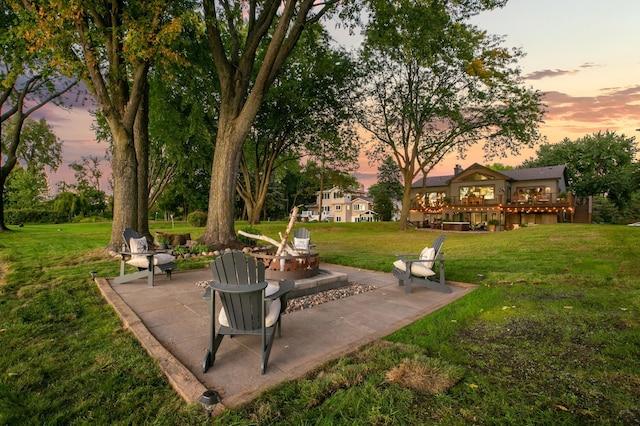 2311 Swan Dr, Mendota Heights, MN 55120 - view of green lawn with a fire pit, a patio, and a wooden deck