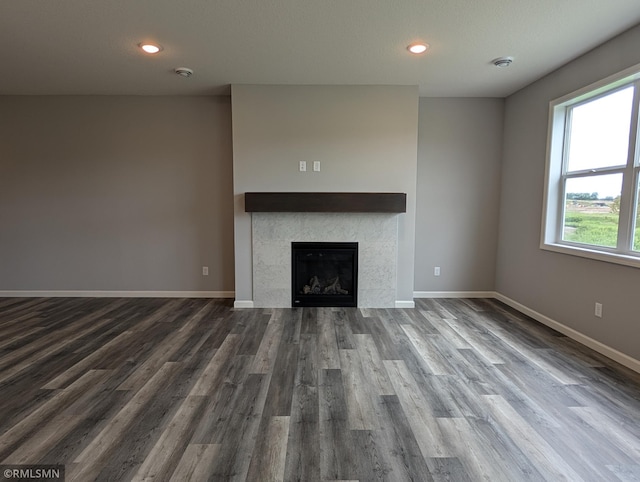 6785 104th St S, Cottage Grove, MN 55016 - unfurnished living room featuring dark wood-style floors, a tile fireplace, and recessed lighting