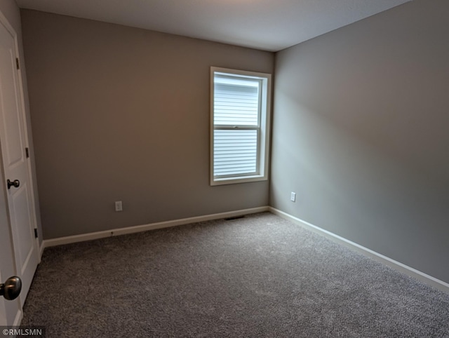 6785 104th St S, Cottage Grove, MN 55016 - carpeted spare room featuring baseboards