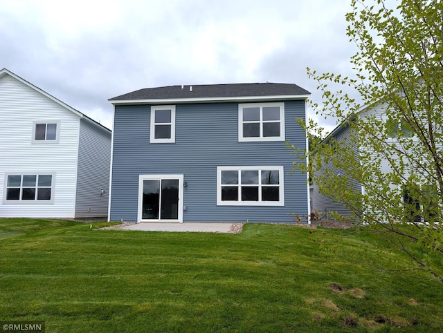 6785 104th St S, Cottage Grove, MN 55016 - rear view of property featuring a patio and a lawn