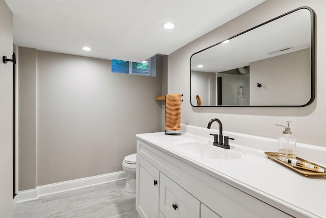 6233 4th Ave S, Richfield, MN 55423 - bathroom featuring marble finish floors, toilet, vanity, recessed lighting, and baseboards