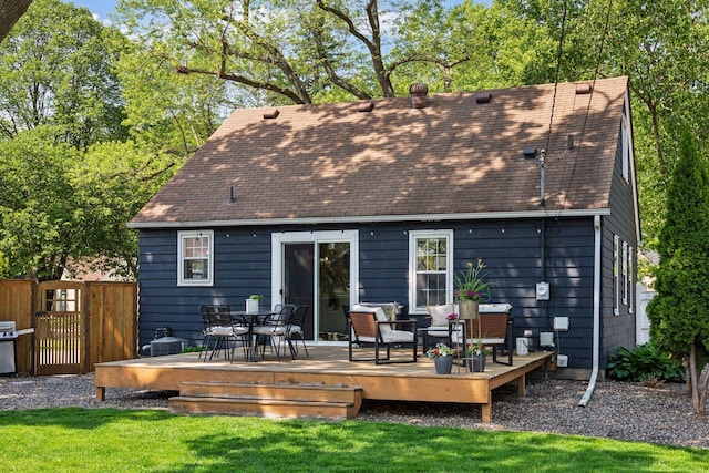 6233 4th Ave S, Richfield, MN 55423 - back of property featuring a wooden deck, roof with shingles, outdoor dining space, and cooling unit