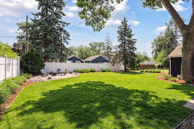 6233 4th Ave S, Richfield, MN 55423 - view of yard featuring a fire pit and a patio