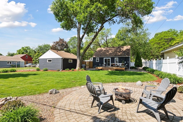 6233 4th Ave S, Richfield, MN 55423 - view of patio / terrace with an outdoor fire pit, an outbuilding, and a deck