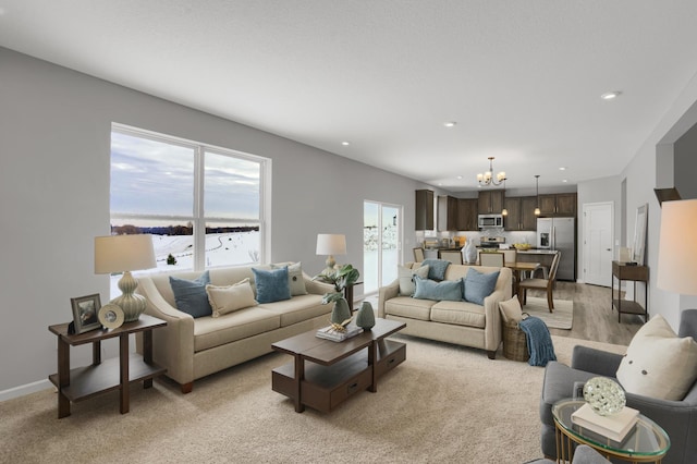 10647 29th St NE, Saint Michael, MN 55376 - living room featuring a chandelier, plenty of natural light, recessed lighting, and baseboards