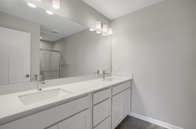 10647 29th St NE, Saint Michael, MN 55376 - bathroom with double vanity, a stall shower, and baseboards
