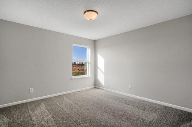 10647 29th St NE, Saint Michael, MN 55376 - unfurnished room with carpet floors, baseboards, and a textured ceiling