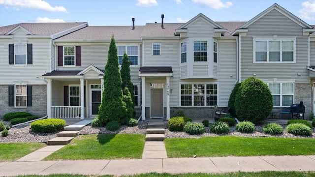 13749 Atrium Ave Unit 2303, Rosemount, MN 55068 - multi unit property featuring brick siding, a porch, and a front yard