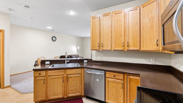 13749 Atrium Ave Unit 2303, Rosemount, MN 55068 - kitchen with stainless steel appliances, a sink, dark countertops, a peninsula, and recessed lighting