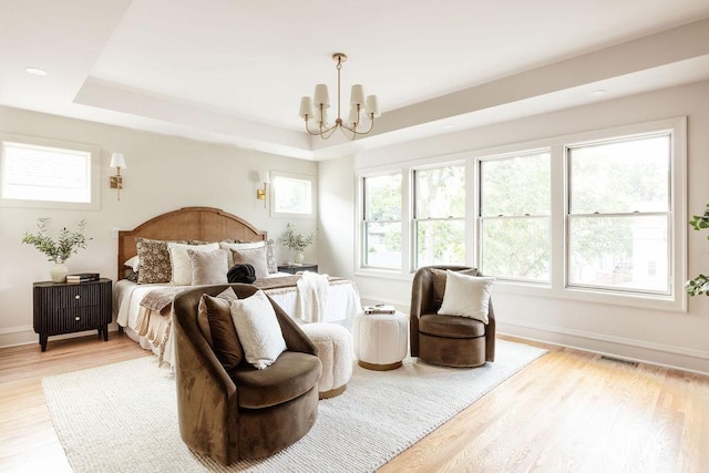2137 Wellesley Ave, Saint Paul, MN 55105 - bedroom featuring a chandelier, light wood-type flooring, a raised ceiling, and recessed lighting
