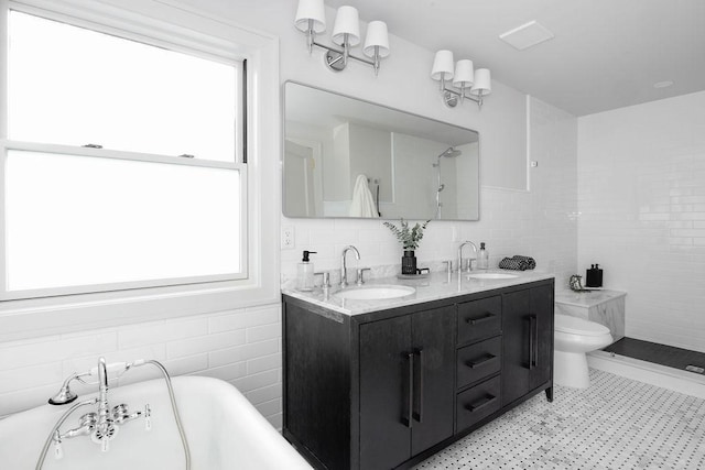 2137 Wellesley Ave, Saint Paul, MN 55105 - bathroom featuring tile walls, double vanity, a soaking tub, tile patterned floors, and a tile shower