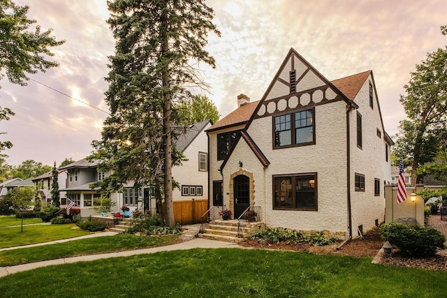 2137 Wellesley Ave, Saint Paul, MN 55105 - tudor house featuring a front lawn and a chimney