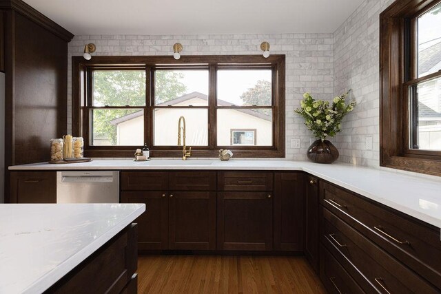 2137 Wellesley Ave, Saint Paul, MN 55105 - kitchen featuring dishwasher, light countertops, dark brown cabinets, and dark wood finished floors
