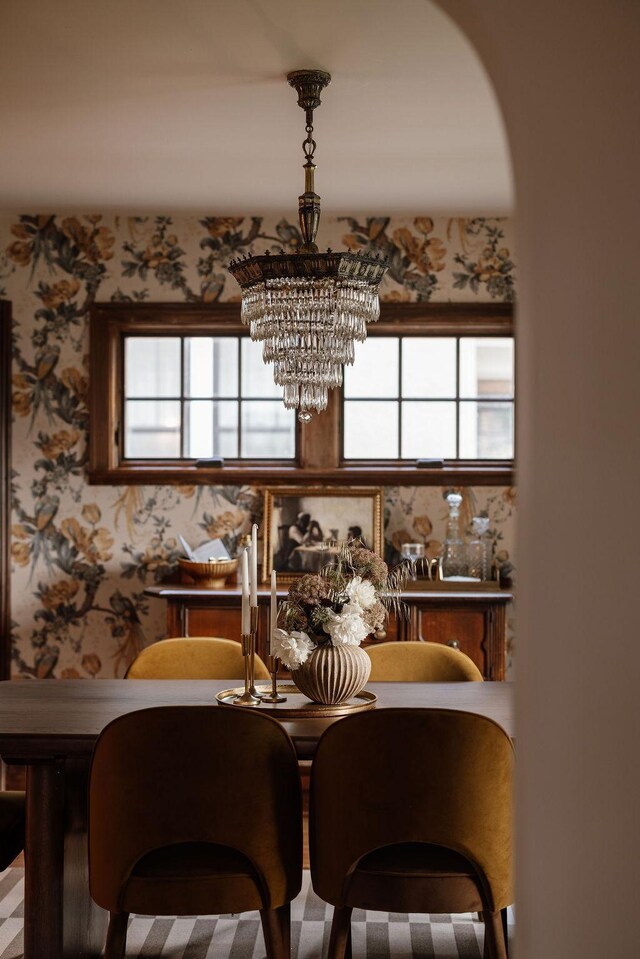 2137 Wellesley Ave, Saint Paul, MN 55105 - dining space with a chandelier, wallpapered walls, and healthy amount of natural light