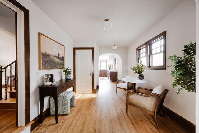 2137 Wellesley Ave, Saint Paul, MN 55105 - sitting room with arched walkways, light wood-style flooring, and stairway