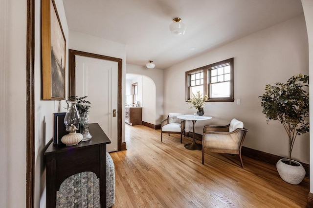2137 Wellesley Ave, Saint Paul, MN 55105 - living area featuring arched walkways and light wood-style flooring