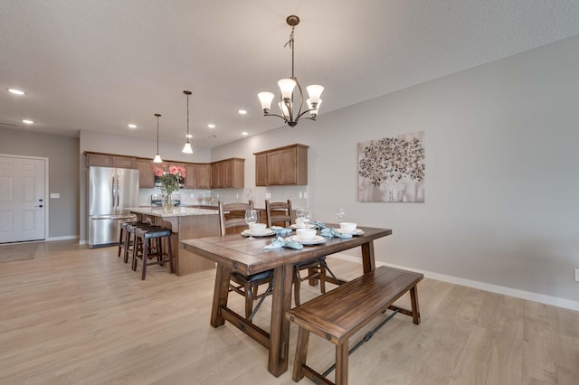 2605 Hanson Ave, Faribault, MN 55021 - dining space with light wood-type flooring, baseboards, a chandelier, and recessed lighting