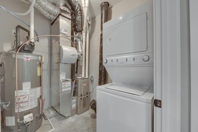 2605 Hanson Ave, Faribault, MN 55021 - laundry room with stacked washer and clothes dryer, water heater, and a textured ceiling